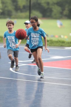 A Kid Playing Football In Tacsports