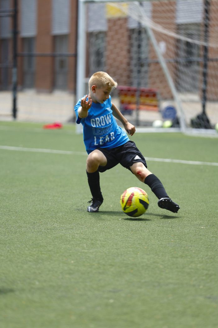 Single Kid Playing Football